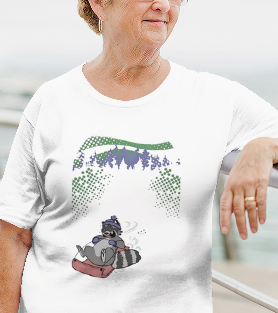 Raccoon Sledding In Winter Forest Scene With Evergreen Trees And Snowflakes T-Shirt