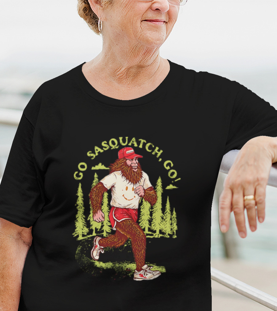 Go Sasquatch Go Bigfoot Jogging In Forest With Red Cap And Sneakers T-Shirt
