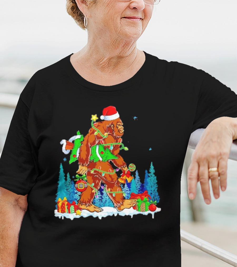 Bigfoot Santa Hugging Christmas Tree With Gifts And Snow Scene T-Shirt