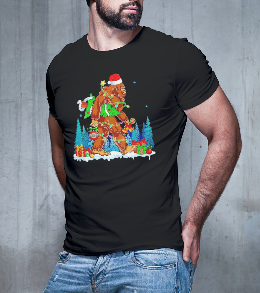 Bigfoot Santa Hugging Christmas Tree With Gifts And Snow Scene T-Shirt