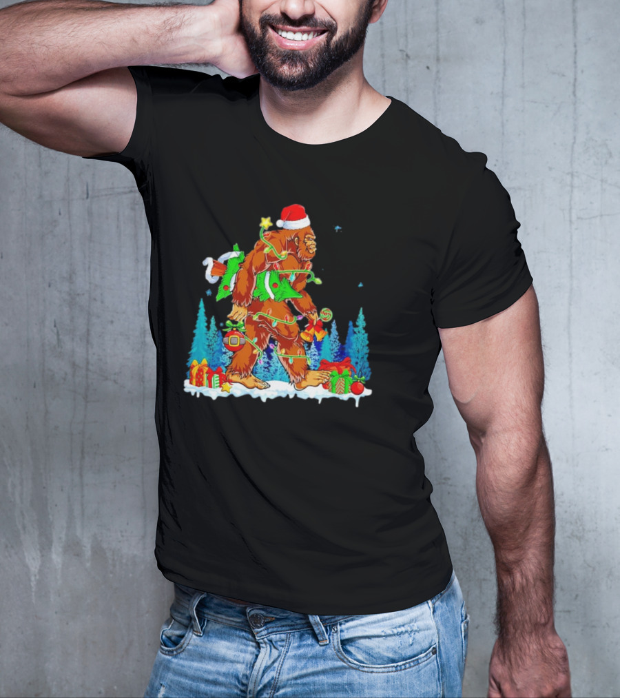 Bigfoot Santa Hugging Christmas Tree With Gifts And Snow Scene T-Shirt