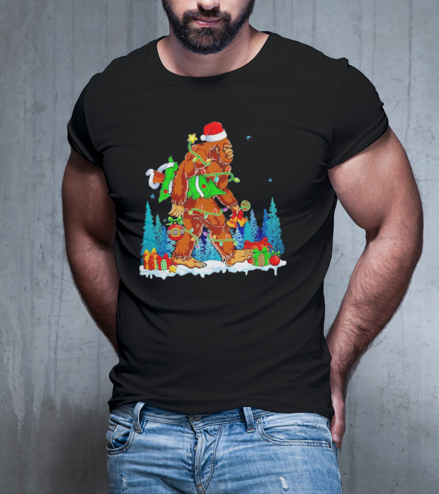 Bigfoot Santa Hugging Christmas Tree With Gifts And Snow Scene T-Shirt