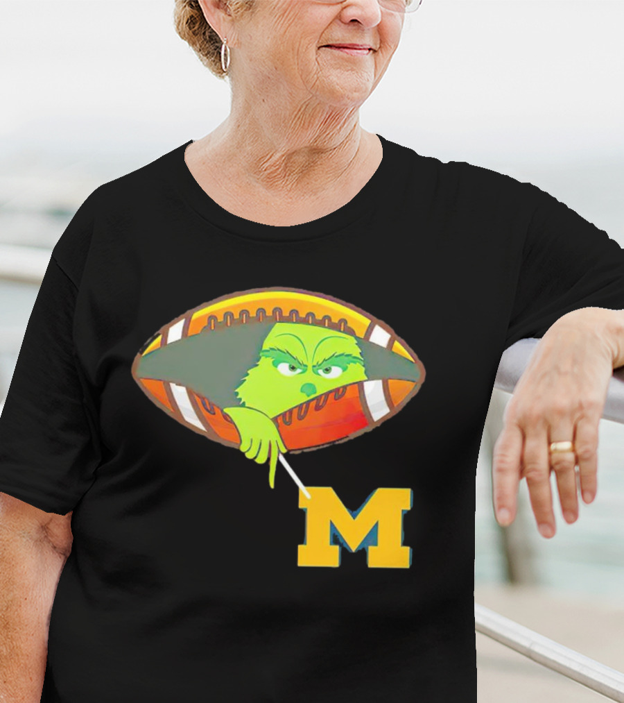 Grinch Peeking From Football Over Michigan Wolverines T-Shirt