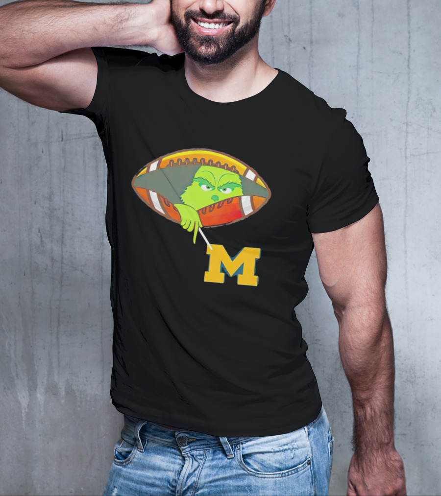 Grinch Peeking From Football Over Michigan Wolverines T-Shirt