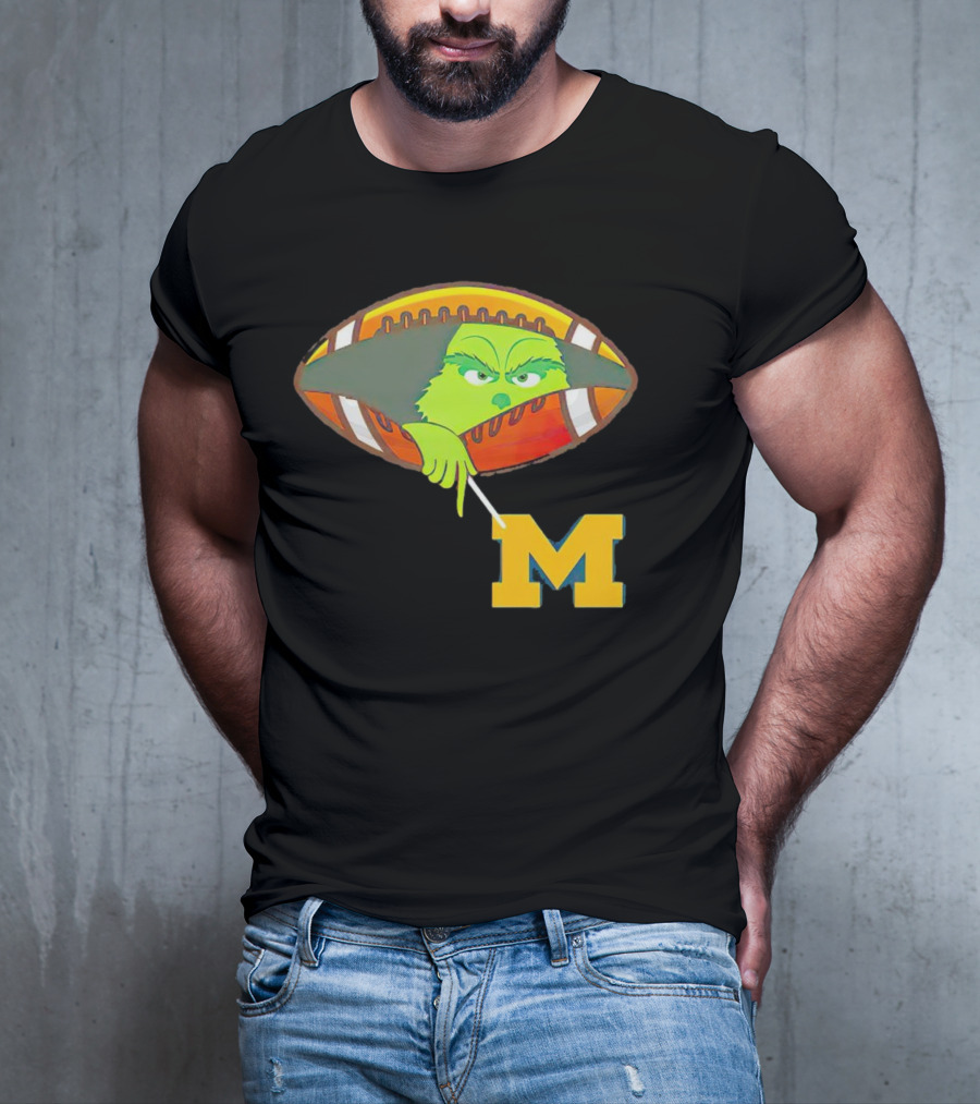 Grinch Peeking From Football Over Michigan Wolverines T-Shirt