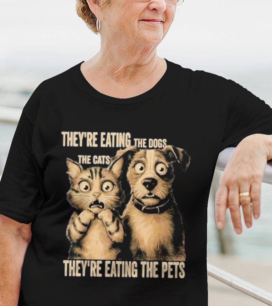 THEY'RE EATING THE DOGS THE CATS THEY'RE EATING THE PETS T-Shirt